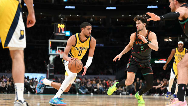 Indiana Pacers guard Tyrese Haliburton (0) makes a move the basket as Washington Wizards forward Deni Avdija (8) defends during the game at Capital One Arena. Washington Wizards defeated Indiana Pacers 137-123. Mandatory Credit: Tommy Gilligan-USA TODAY Sports